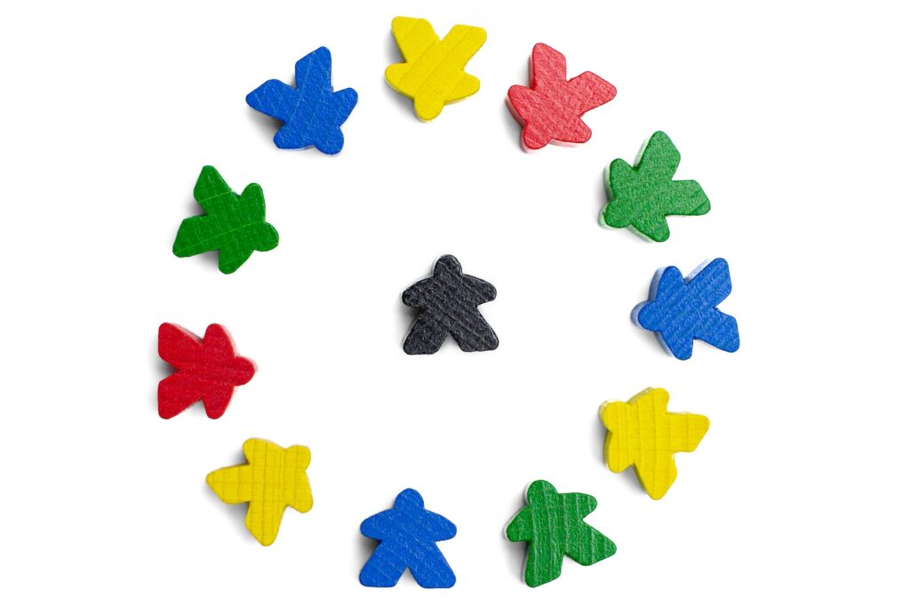 Leader in a centre of a circle of motivated group of people on a white background. Connecting people
